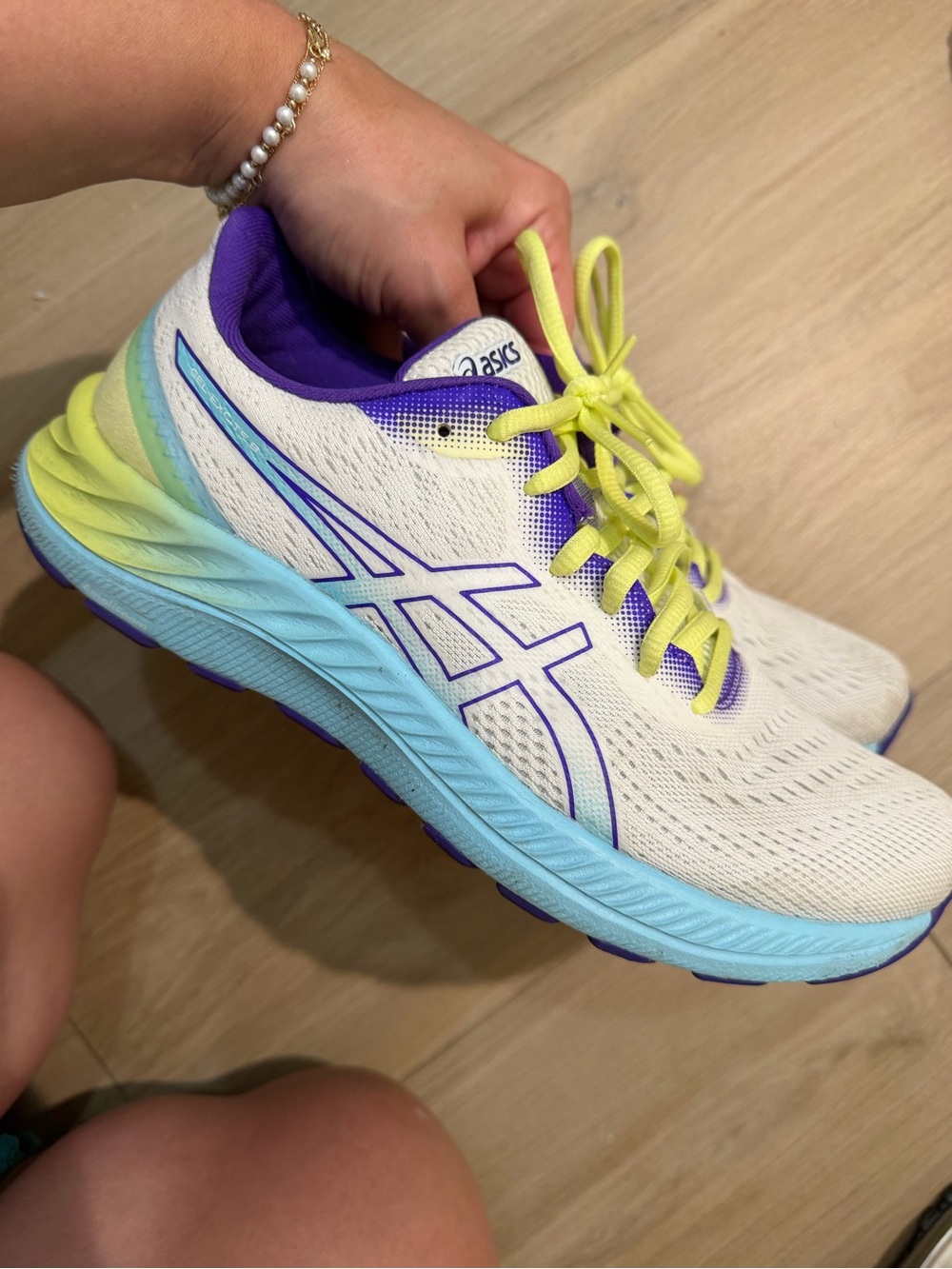 ASICS White Running Shoes with Purple Accents and Yellow Laces